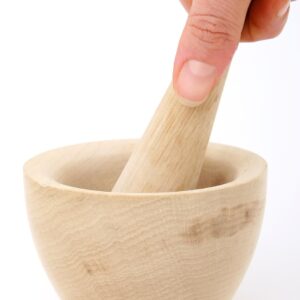 accessory, appliance, chef, cook, cookery, cooking, crush, crushed, crushing, culinary, domestic, fingers, flavour, food, fresh, gadget, girl, grind, grinding, ground, hand, handheld, handle, herbs, home, household, ingredients, isolated, isolation, item, kitchen, lady, macro, mix, mixing, model, mortar, object, over, pestle, salt, seeds, spice, thumb, tool, utensil, white, woman, wood, wooden