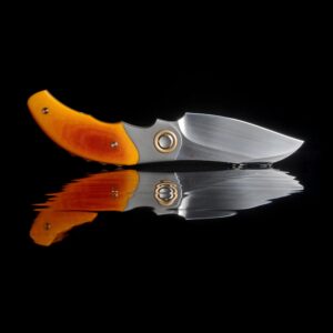 Close-up of a pocket knife with an orange handle, reflecting on glossy surface.