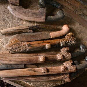 Exquisite handcrafted Sumbawa parang knives with intricate carvings, West Nusa Tenggara.